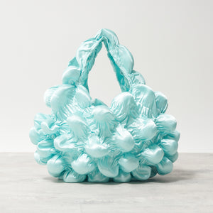 大きなぽんぽんのバッグ サテン